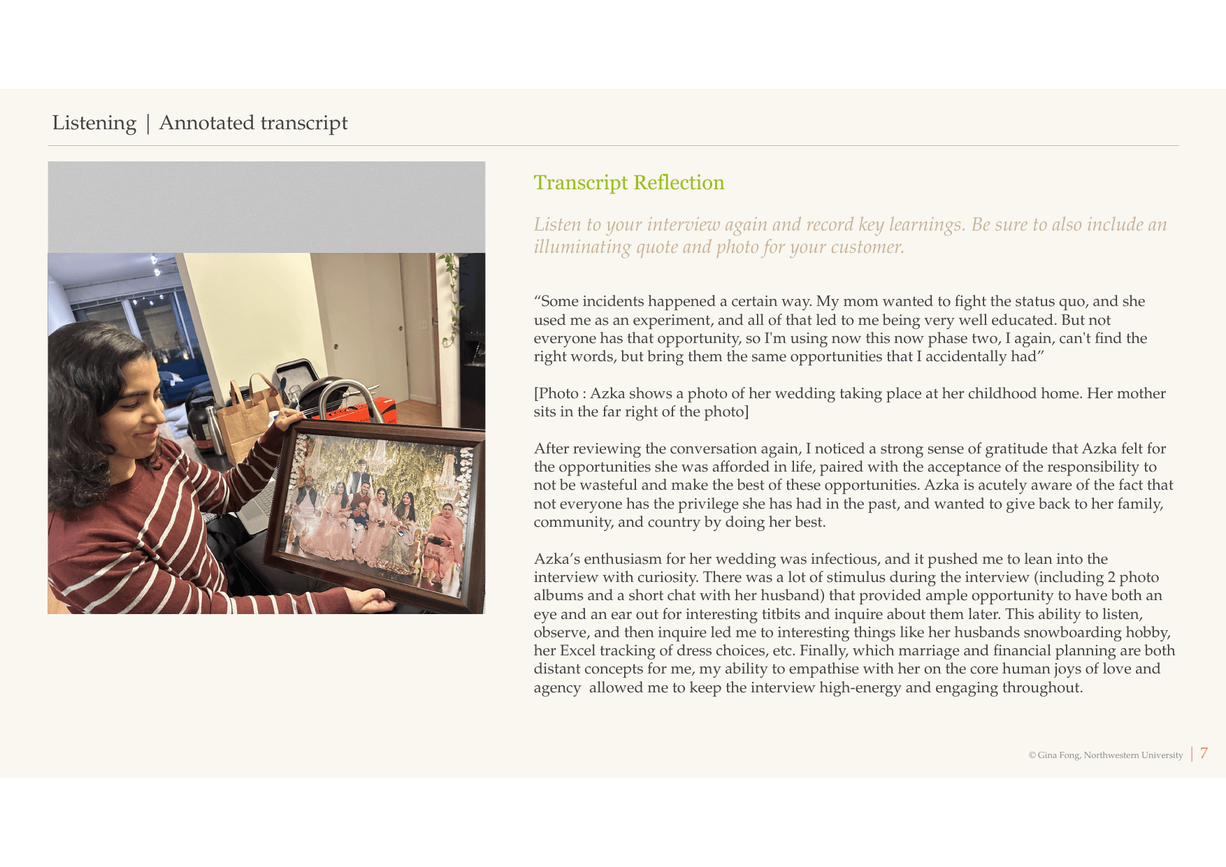 Azka holding open a wedding photo album, smiling, pointing at a specific image